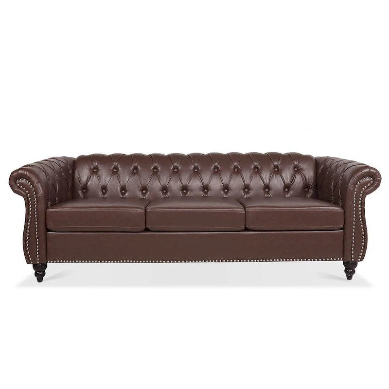 84.65 Divano Chesterfield in finta pelle trapuntata con braccioli arrotolati
