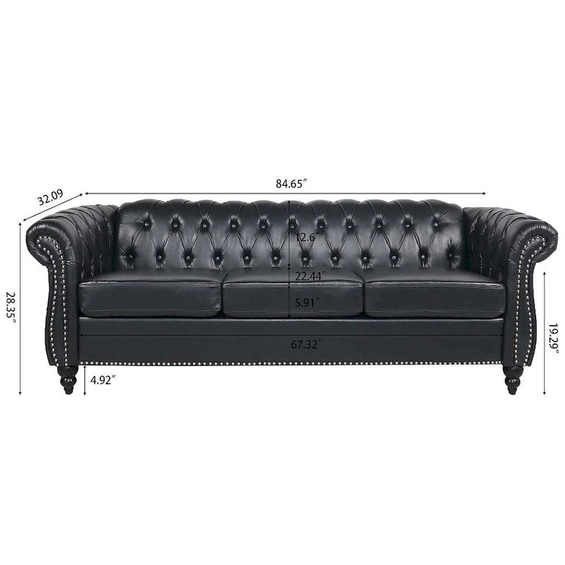 84.65 Divano Chesterfield in finta pelle trapuntata con braccioli arrotolati