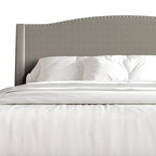 Letto imbottito Wingback con borchie cromate e cassetti contenitore