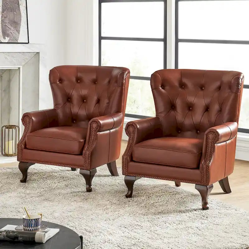 Poltrona in vera pelle con finiture borchiate e set di 2 cuscini sfoderabili